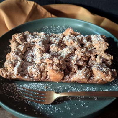 Oops! Bread Pudding – Crispy, Custardy, and Oh-So-Good A freshly baked pan of Oops! Bread Pudding, golden brown and topped with a crisp, buttery crumble.