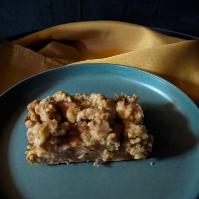 Freshly Baked Bread Pudding – Warm, Golden, and Delicious A freshly baked bread pudding, golden brown and warm, just out of the oven. The soft, custardy center contrasts with the crisp, caramelized edges, ready for a delicious topping or to be enjoyed as is.